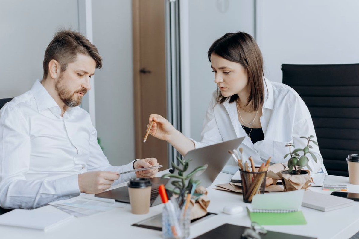 Two colleagues going through paperwork together